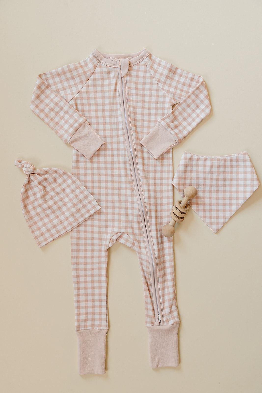 August & Ivy organic Pima cotton zip romper for infants, soft and comfortable baby clothing with front zipper closure.