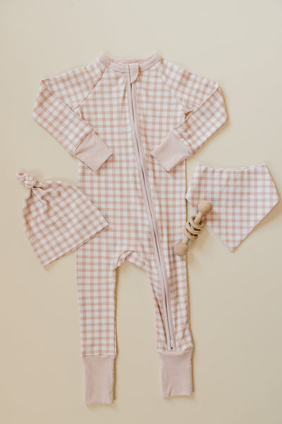 August & Ivy organic Pima cotton zip romper for infants, soft and comfortable baby clothing with front zipper closure.