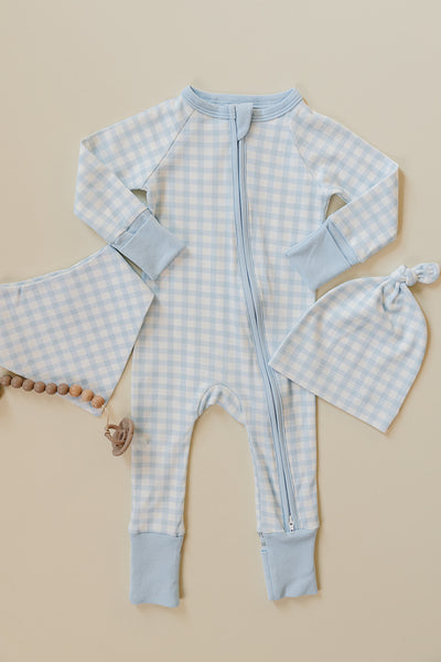 August & Ivy organic Pima cotton zip romper for babies, soft and comfortable one-piece clothing with a front zipper.