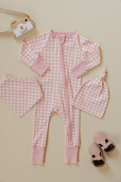 August & Ivy organic Pima cotton zip romper for babies, soft and comfortable, shown in a close-up of the front design.