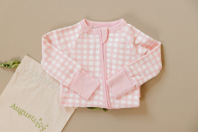 August & Ivy organic Pima cotton zip romper for babies, soft and comfortable with front zipper and long sleeves.
