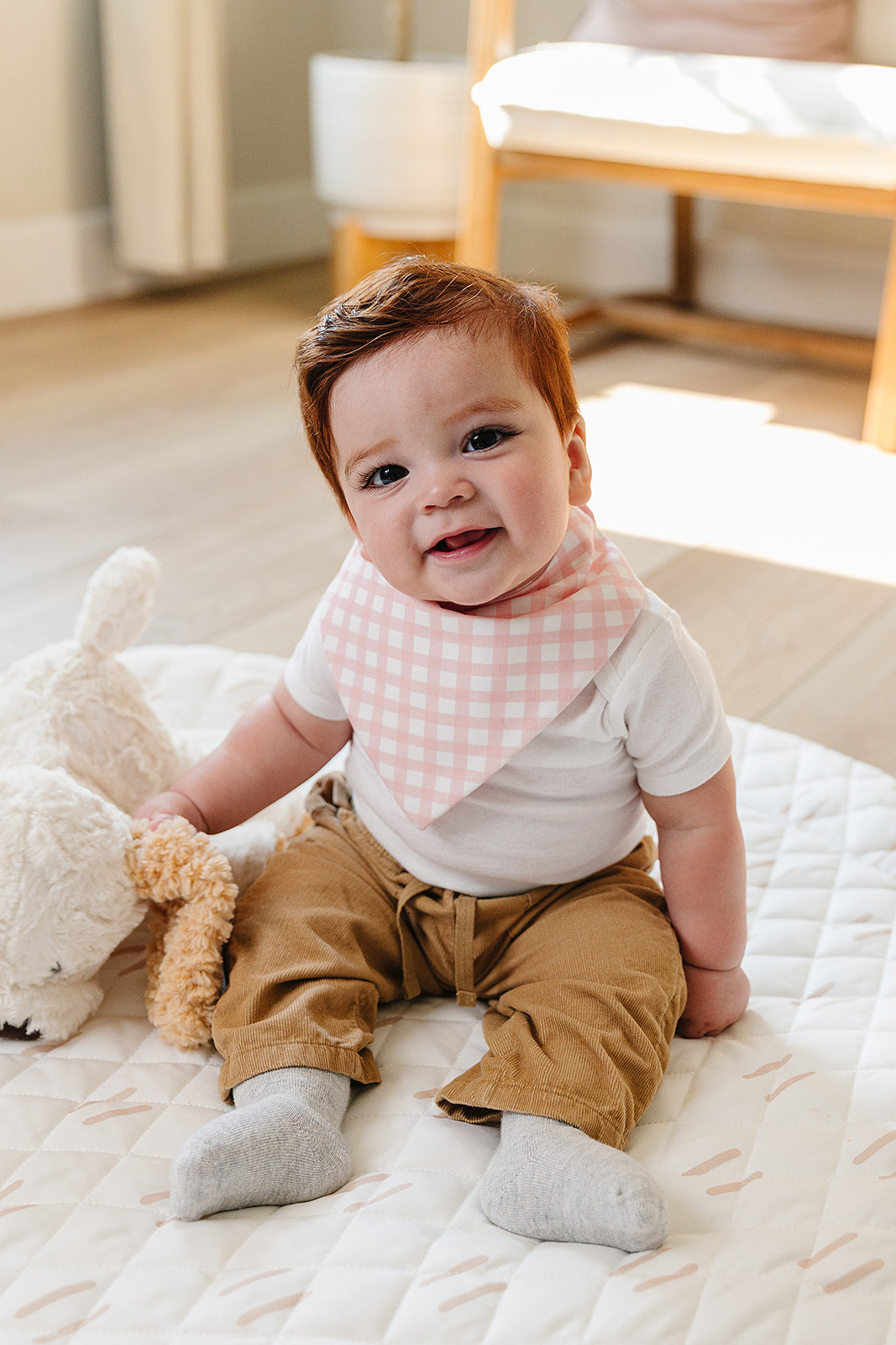 Organic Pima Cotton bandana bib by August & Ivy™ featuring a soft, stylish design with vibrant colors and playful patterns.