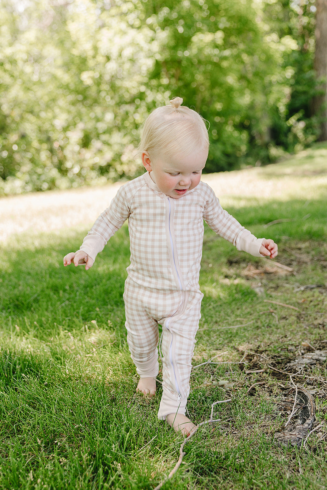 August & Ivy organic Pima cotton zip romper for babies, soft and comfortable one-piece clothing with front zipper.