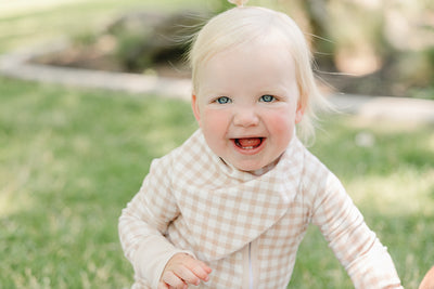 August & Ivy organic Pima cotton zip romper for babies, soft and comfortable with a front zipper and adorable design.