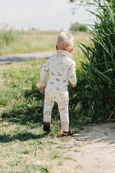 August & Ivy organic Pima cotton zip romper for babies, soft and comfortable with a front zipper, perfect for everyday wear.
