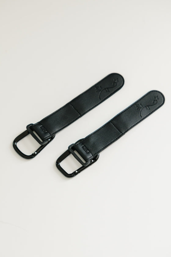 August & Ivy IvyGo™ everyday companion in a sleek black design, featuring a compact, portable accessory with subtle branding.