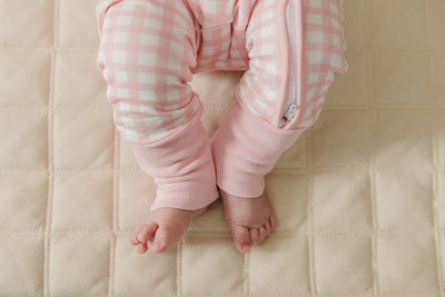 August & Ivy organic Pima cotton zip romper for babies, soft and comfortable with a front zipper and playful design.