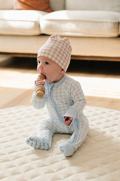 August & Ivy organic Pima cotton zip romper for babies, featuring a soft, comfortable design with front zipper closure.