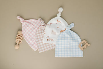 Organic Pima cotton knotted hat by August & Ivy™, featuring a soft, breathable fabric with a stylish knotted design for infants.