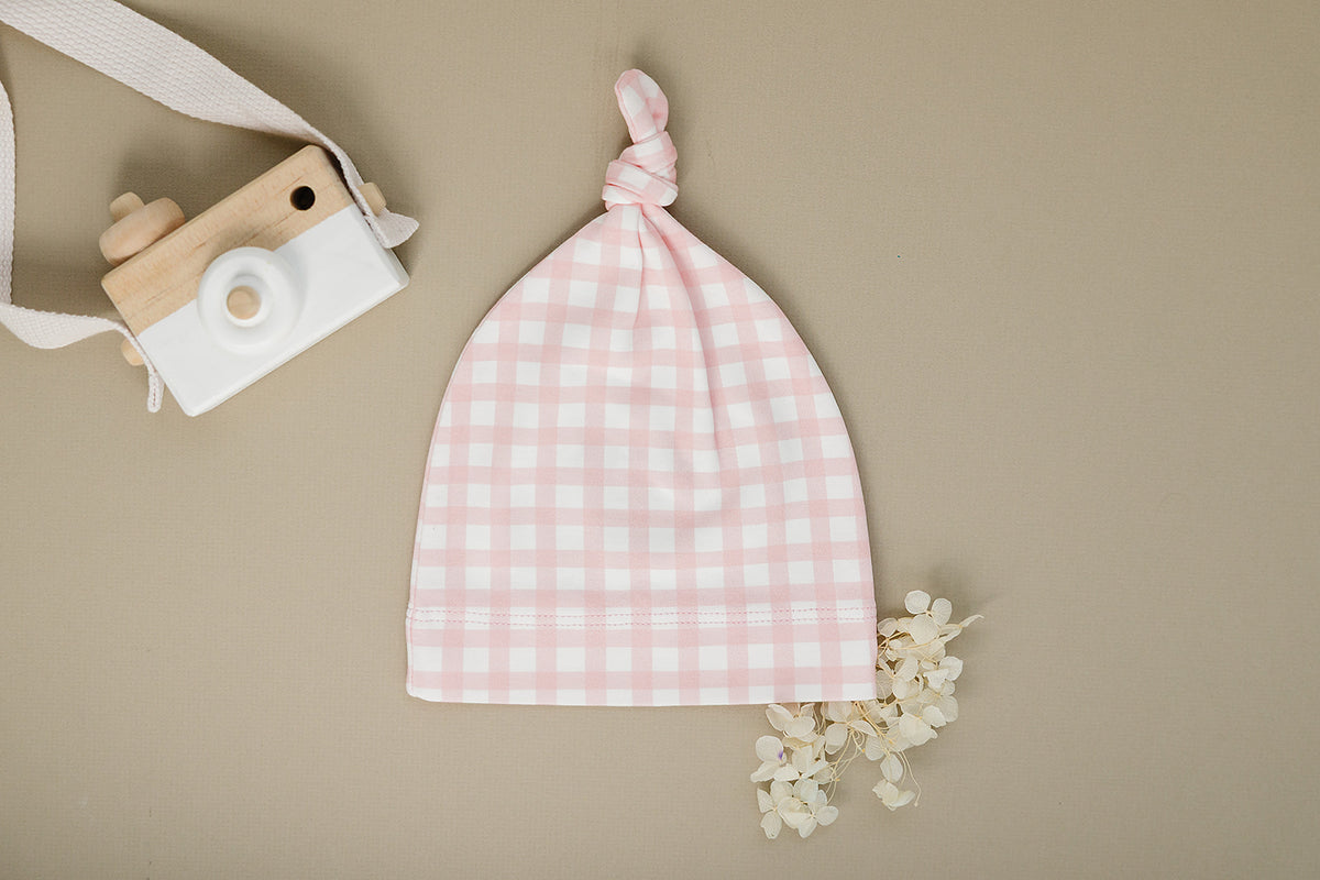 Organic Pima cotton knotted hat by August & Ivy™ with a soft, breathable design and stylish knot detail.