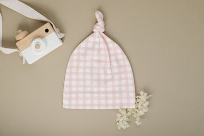 Organic Pima cotton knotted hat by August & Ivy™ with a soft, breathable design and stylish knot detail.