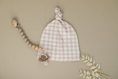 Organic Pima cotton knotted hat by August & Ivy™, showing a soft, breathable fabric and stylish knotted design for infants.