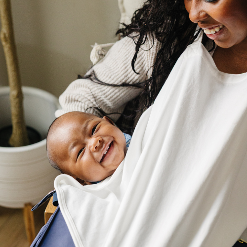 Hidden nursing cover inside modern diaper bag for privacy