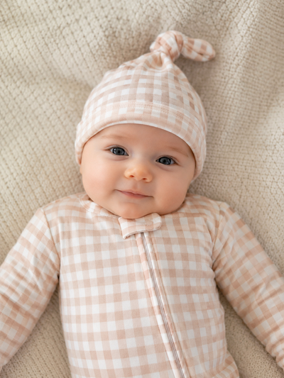 Organic Pima Cotton knotted hat by August & Ivy™, featuring a soft, breathable fabric and stylish knotted design for infants.
