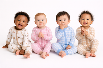Organic Pima cotton romper by August & Ivy, featuring a soft, comfortable design with short sleeves and a playful print.