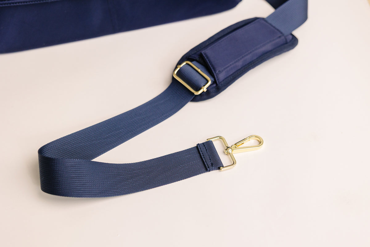 August & Ivy IvyGo™: The Everyday Companion, Adjustable padded shoulder strap with gold hardware on the August & Ivy IvyGo diaper bag for comfortable carrying.