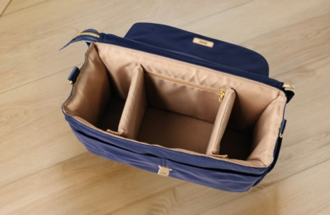 Empty August & Ivy IvyGo structured diaper bag showing organized interior compartments and smart storage layout
