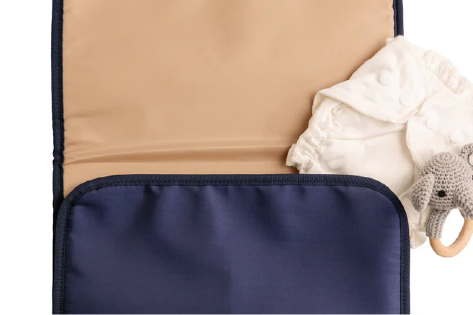 Portable wipeable changing pad included with the August & Ivy IvyGo diaper bag for clean diaper changes on the go.