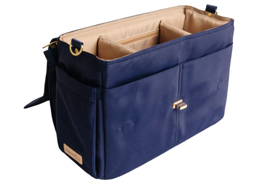 August & Ivy IvyGo™ everyday companion bag with sleek design, featuring multiple compartments and adjustable straps. Structured interior of the August & Ivy IvyGo diaper bag showing built-in organization compartments for baby essentials.