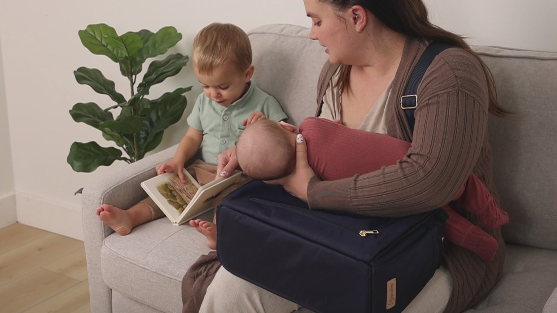 Ergonomic diaper bag supporting comfortable breastfeeding on the go